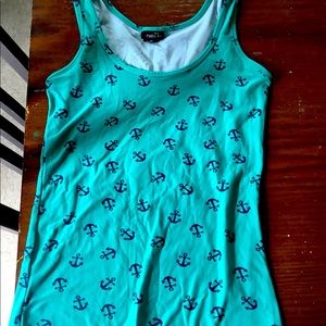 This photo has a cute blue tank top with black anchors. It’s great for summer!